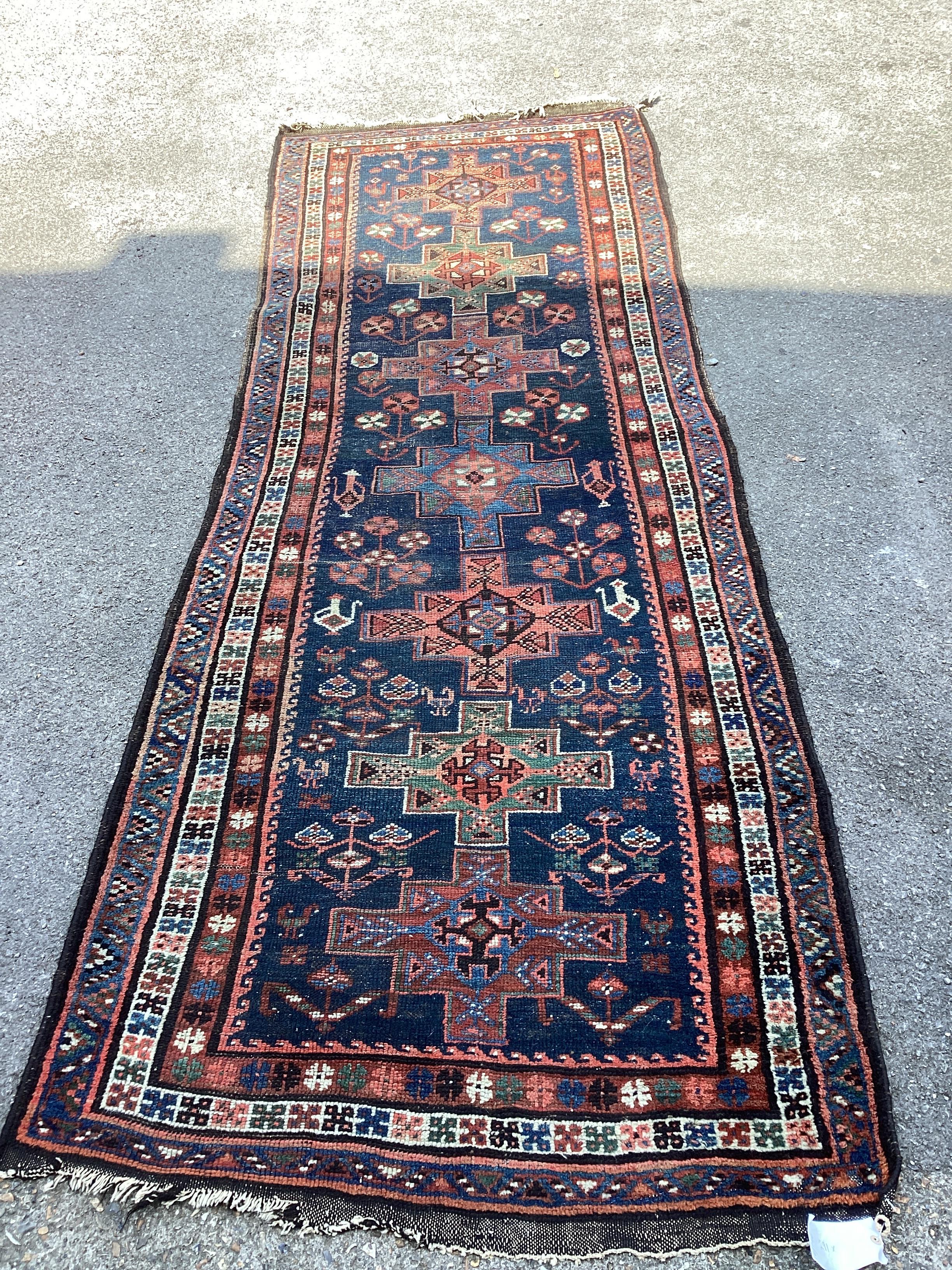 An antique South West Persian blue ground Luri runner, 291 x 114cm